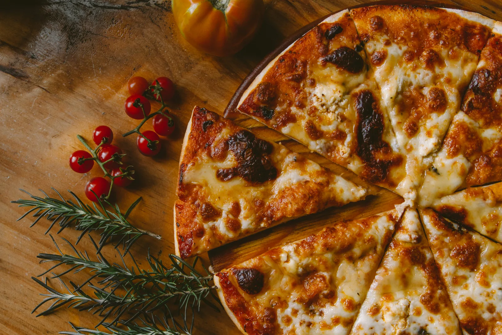 Flavoura Web signature pizza fresh out of the fire oven with golden crust and premium toppings